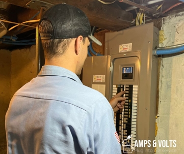 guy working on an electrical panel